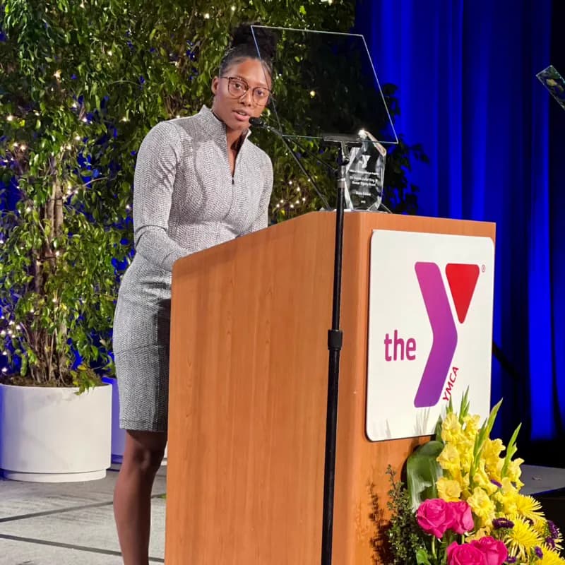 Blake Bolden speaking at a YMCA podium